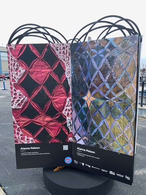 Images of Alanna Nelson's art quilts on display on a grey summer day in New Bedford for DATMA's 2023 Open Studios on the Sidewalk